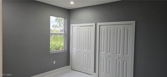 bedroom with two closets