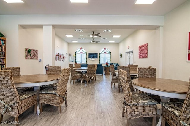 dining area featuring hardwood / wood-style flooring and ceiling fan