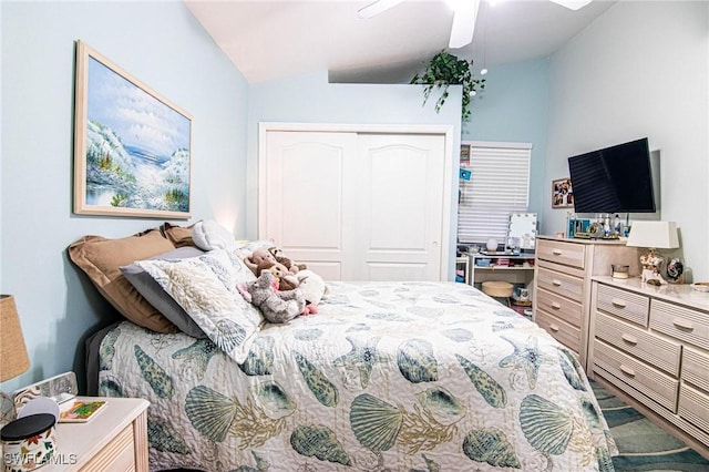 bedroom with ceiling fan, a closet, and lofted ceiling