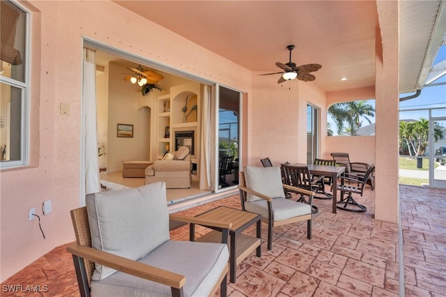 view of patio featuring ceiling fan