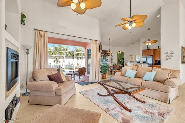 tiled living room with high vaulted ceiling