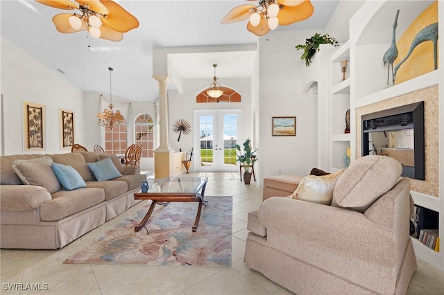 tiled living room featuring ceiling fan, french doors, and built in features