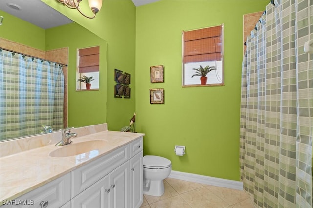 bathroom with tile patterned flooring, vanity, toilet, and walk in shower