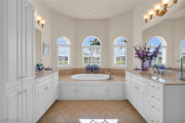 bathroom with tile patterned flooring, a bathtub, a high ceiling, and vanity