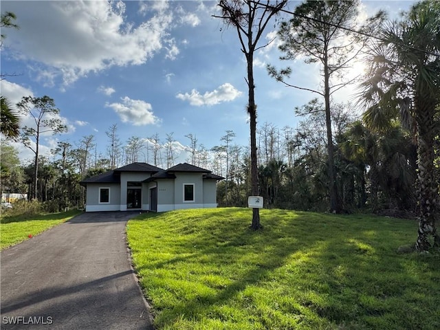 view of front of home with a front yard