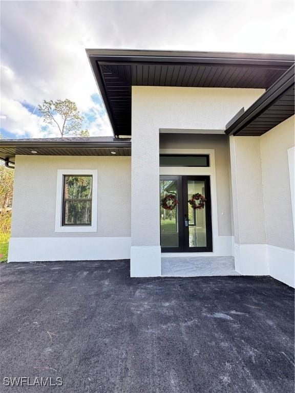 doorway to property featuring french doors and a patio area