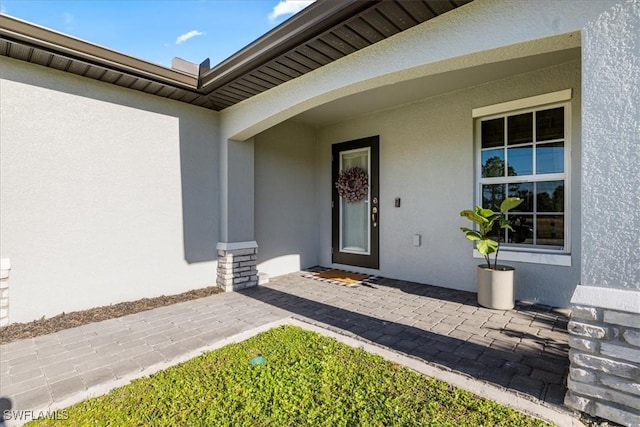 property entrance featuring a porch