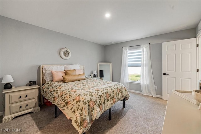 bedroom featuring light carpet