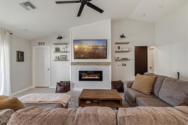 living room with ceiling fan, light colored carpet, and lofted ceiling