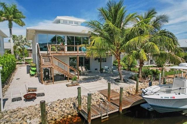 rear view of property featuring a patio