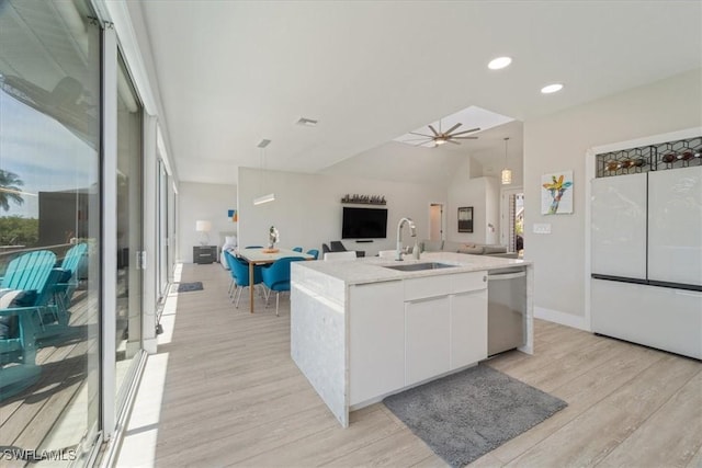 kitchen featuring dishwasher, sink, hanging light fixtures, a kitchen island with sink, and white cabinets