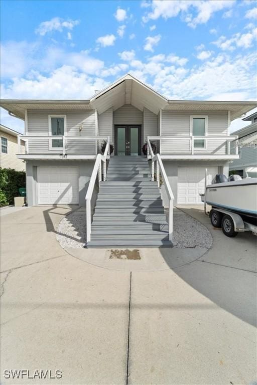 view of front of house with french doors and a garage