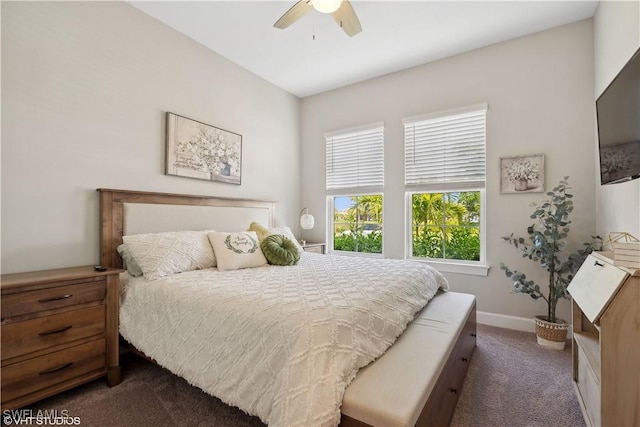 carpeted bedroom featuring ceiling fan and multiple windows