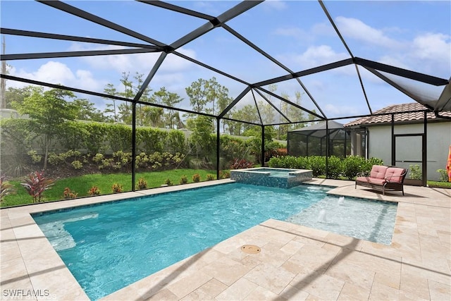 view of swimming pool with an in ground hot tub, a patio, and a lanai