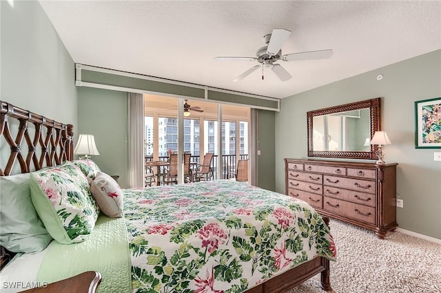 carpeted bedroom featuring access to exterior, ceiling fan, baseboards, and a textured ceiling