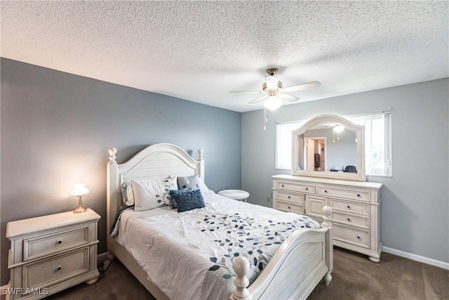 carpeted bedroom featuring a textured ceiling and ceiling fan