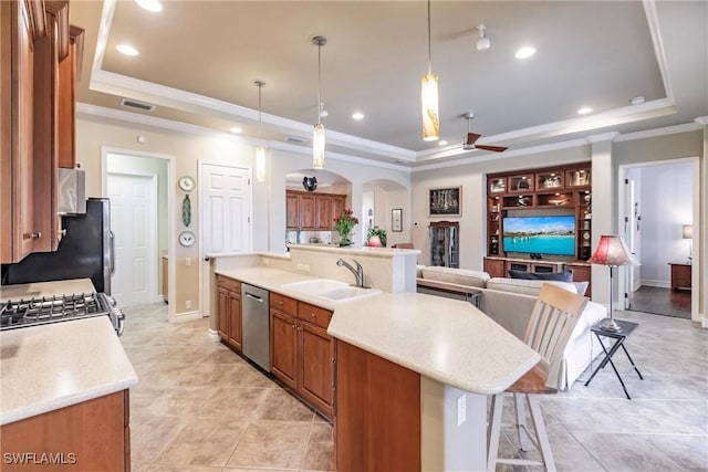 kitchen with decorative light fixtures, a raised ceiling, and dishwasher