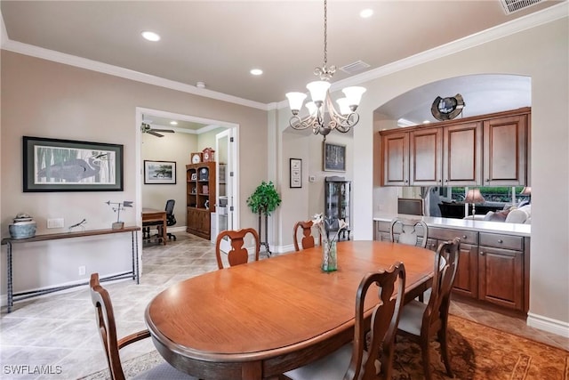 tiled dining room featuring ceiling fan with notable chandelier and ornamental molding