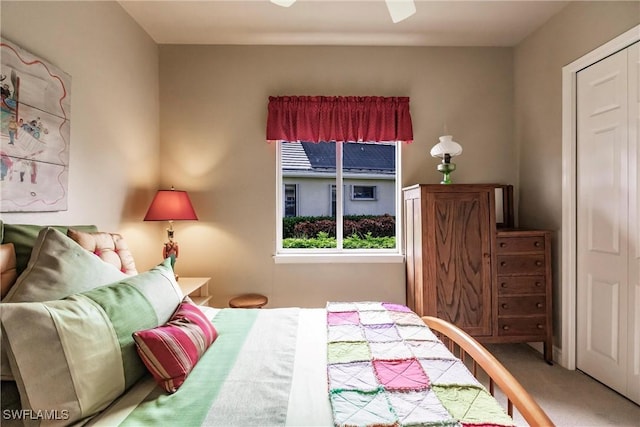 carpeted bedroom with ceiling fan