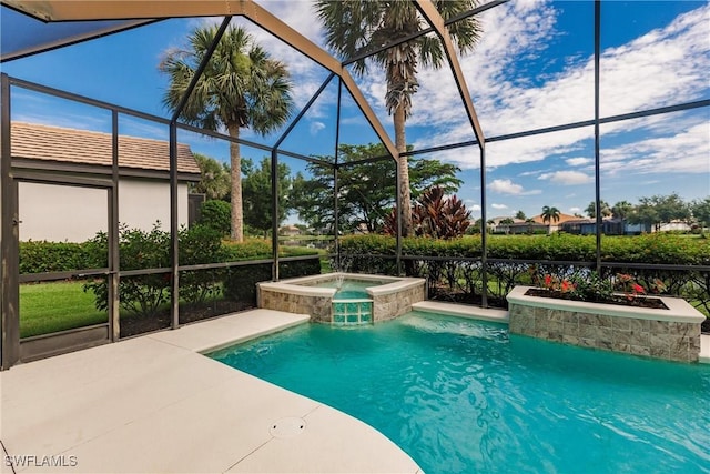 view of swimming pool featuring glass enclosure, an in ground hot tub, and a patio