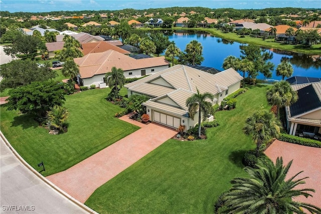 birds eye view of property with a water view