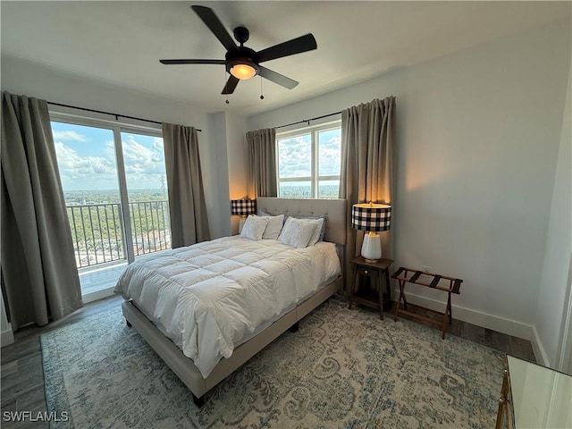 bedroom featuring access to exterior, wood-type flooring, and ceiling fan