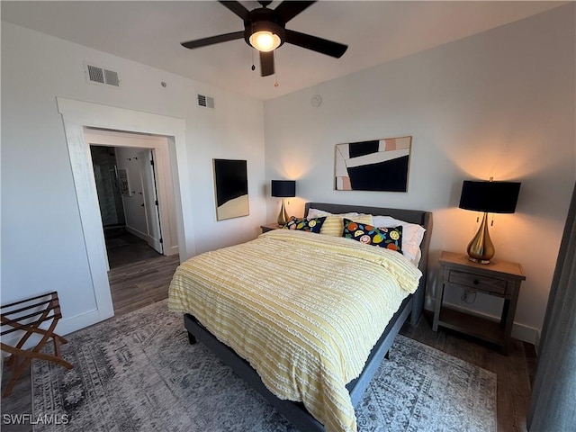 bedroom featuring dark hardwood / wood-style floors and ceiling fan