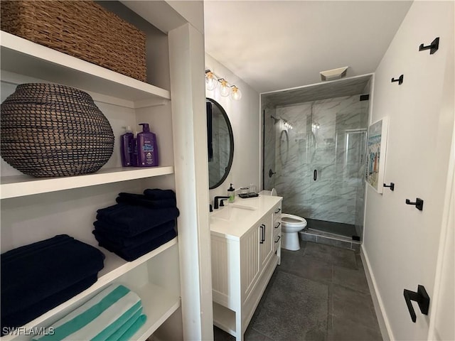 bathroom with vanity, a shower with door, and toilet