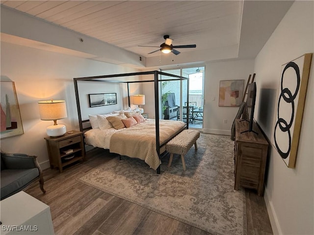 bedroom featuring wood ceiling, access to outside, a raised ceiling, ceiling fan, and hardwood / wood-style floors