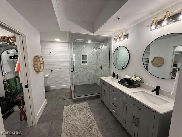 bathroom featuring vanity and a shower with shower door