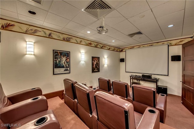 home theater room with crown molding, a paneled ceiling, and carpet flooring