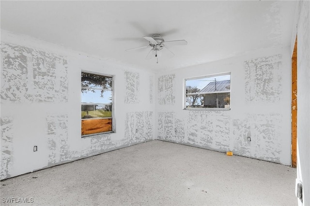 spare room with ceiling fan