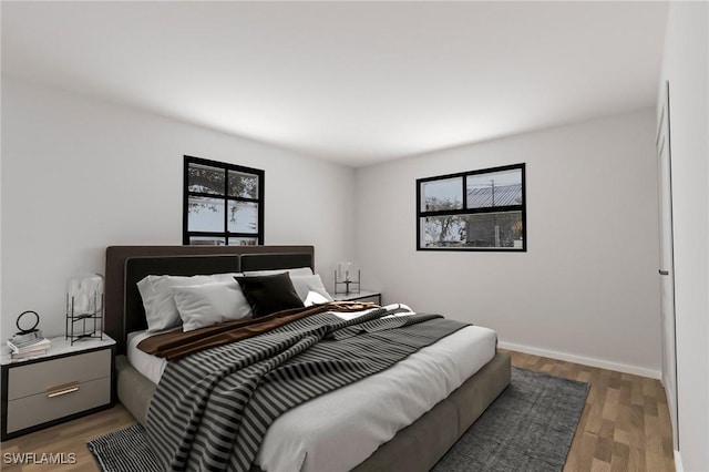 bedroom with dark hardwood / wood-style floors