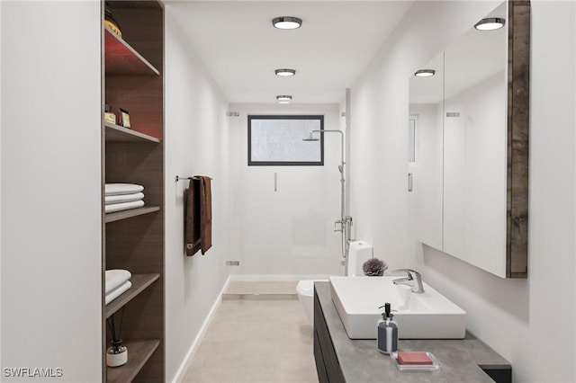 bathroom with vanity, toilet, and a shower