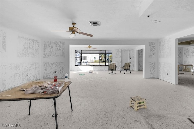 unfurnished living room with ceiling fan