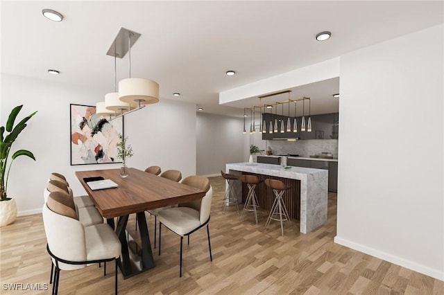 dining space with light wood-type flooring