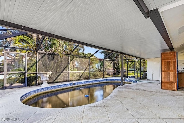 view of pool with a lanai and a patio area