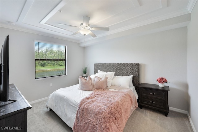 bedroom with crown molding, light colored carpet, and ceiling fan