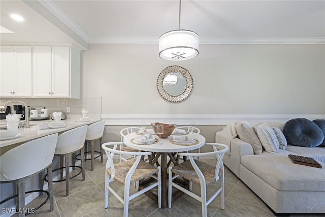 tiled dining area with ornamental molding