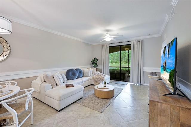 tiled living room with ornamental molding and ceiling fan