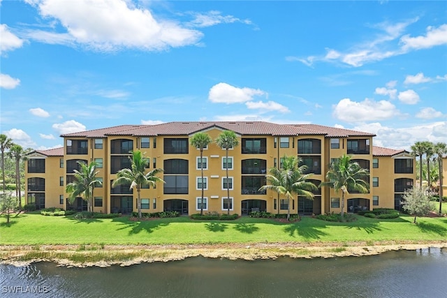 view of building exterior featuring a water view