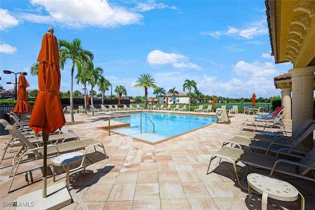 view of swimming pool with a patio area