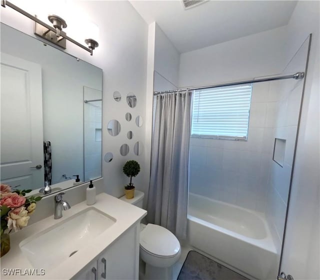 12830 Hawkins Dr, Estero, FL 33928 - bathroom featuring vanity and shower / bath combo with shower curtain