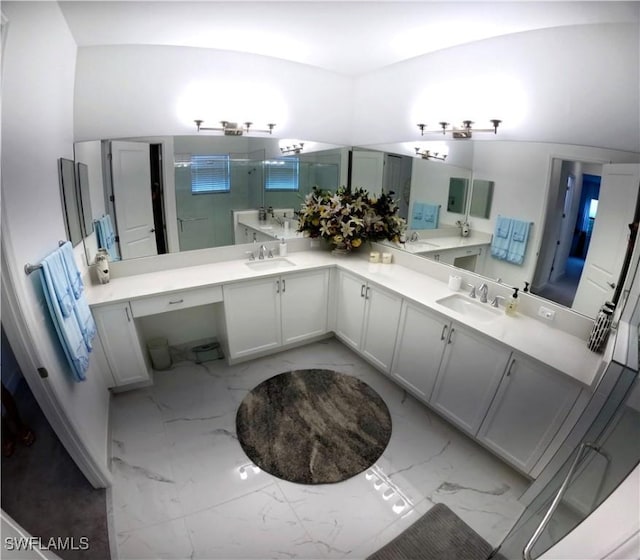 bathroom featuring vanity, a shower with shower door, and vaulted ceiling