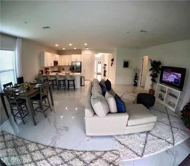 12830 Hawkins Dr, Estero, FL 33928 - living room with light marble finish flooring and recessed lighting