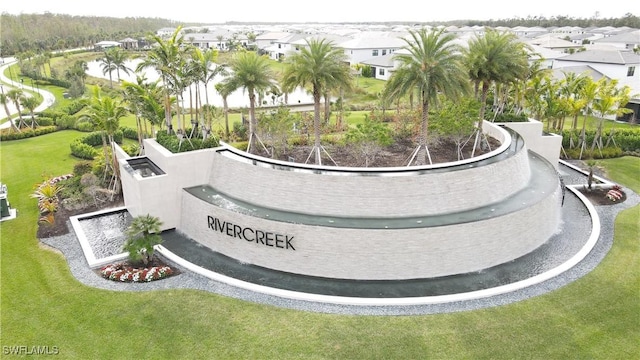 12830 Hawkins Dr, Estero, FL 33928 - surrounding community with a residential view and a yard