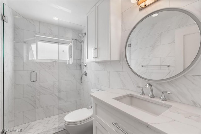 bathroom featuring tasteful backsplash, an enclosed shower, toilet, vanity, and tile walls