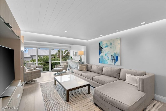 living room featuring wood ceiling and light hardwood / wood-style floors