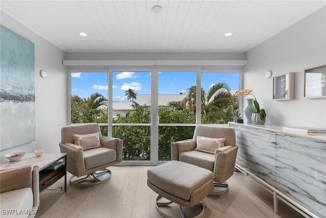 sunroom / solarium with wood ceiling and a wealth of natural light