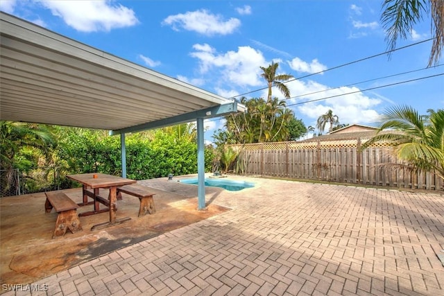 view of patio featuring a fenced in pool